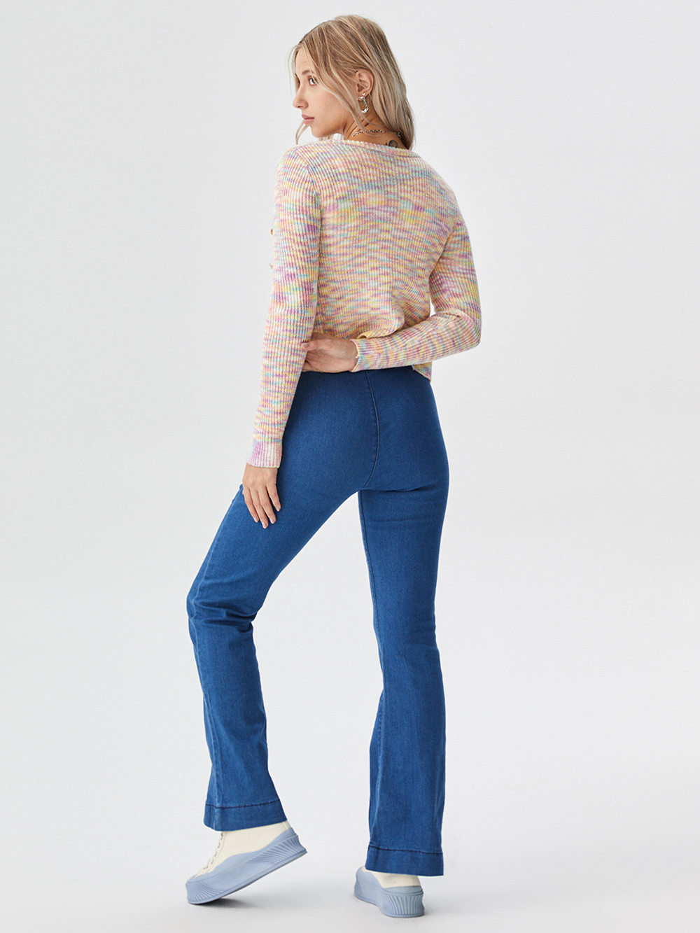 Professional Put Clothes on Model AI for Womens Casual Wear with Standard Model featuring Studio Model wearing Sweaters in Minimalist White Studio, Professional style.