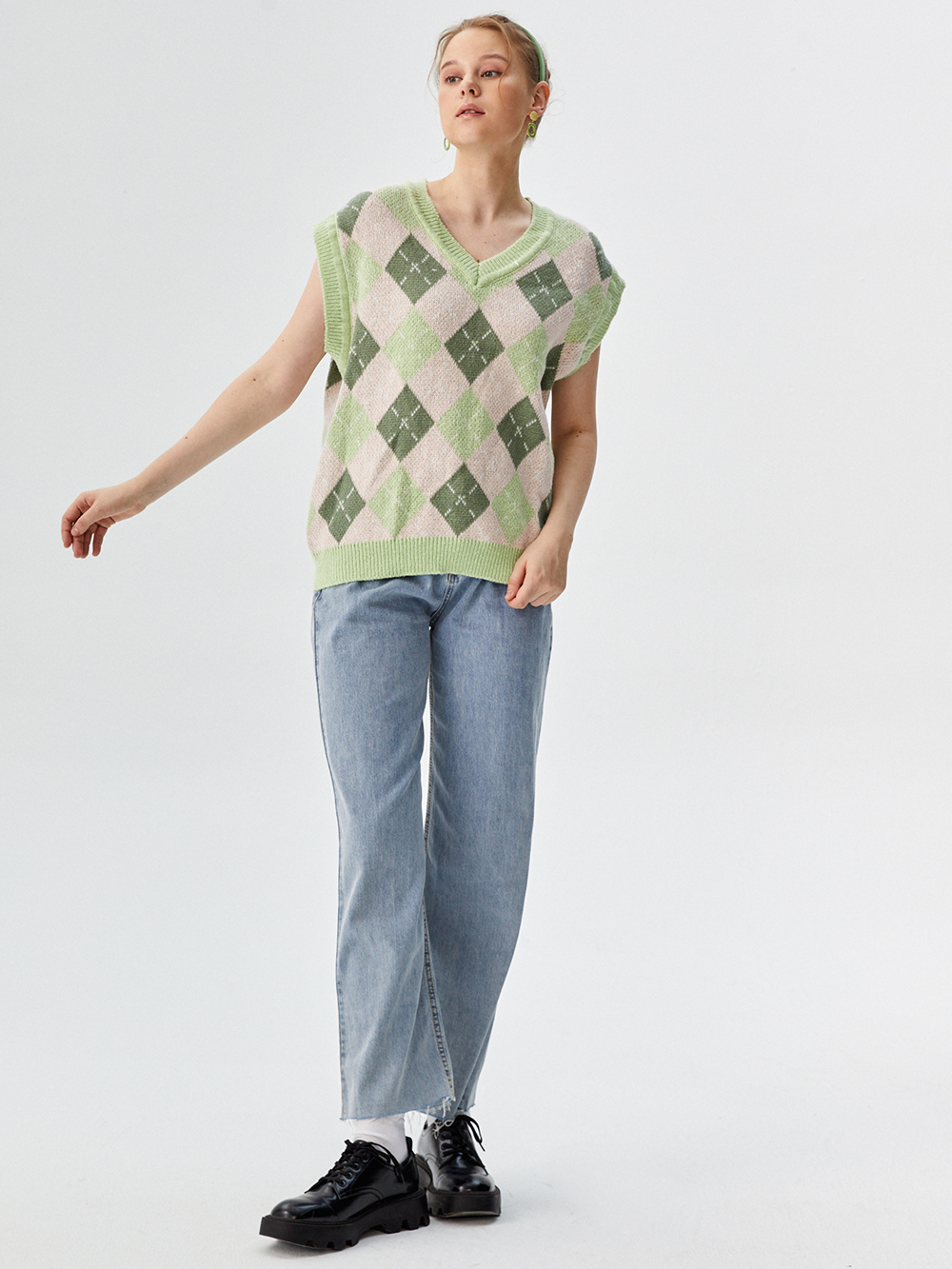 Professional Ghost Mannequin to Model for Sweater Vests with Studio Model featuring Studio Model wearing Sweater Vests in Minimalist White Studio, Professional style.