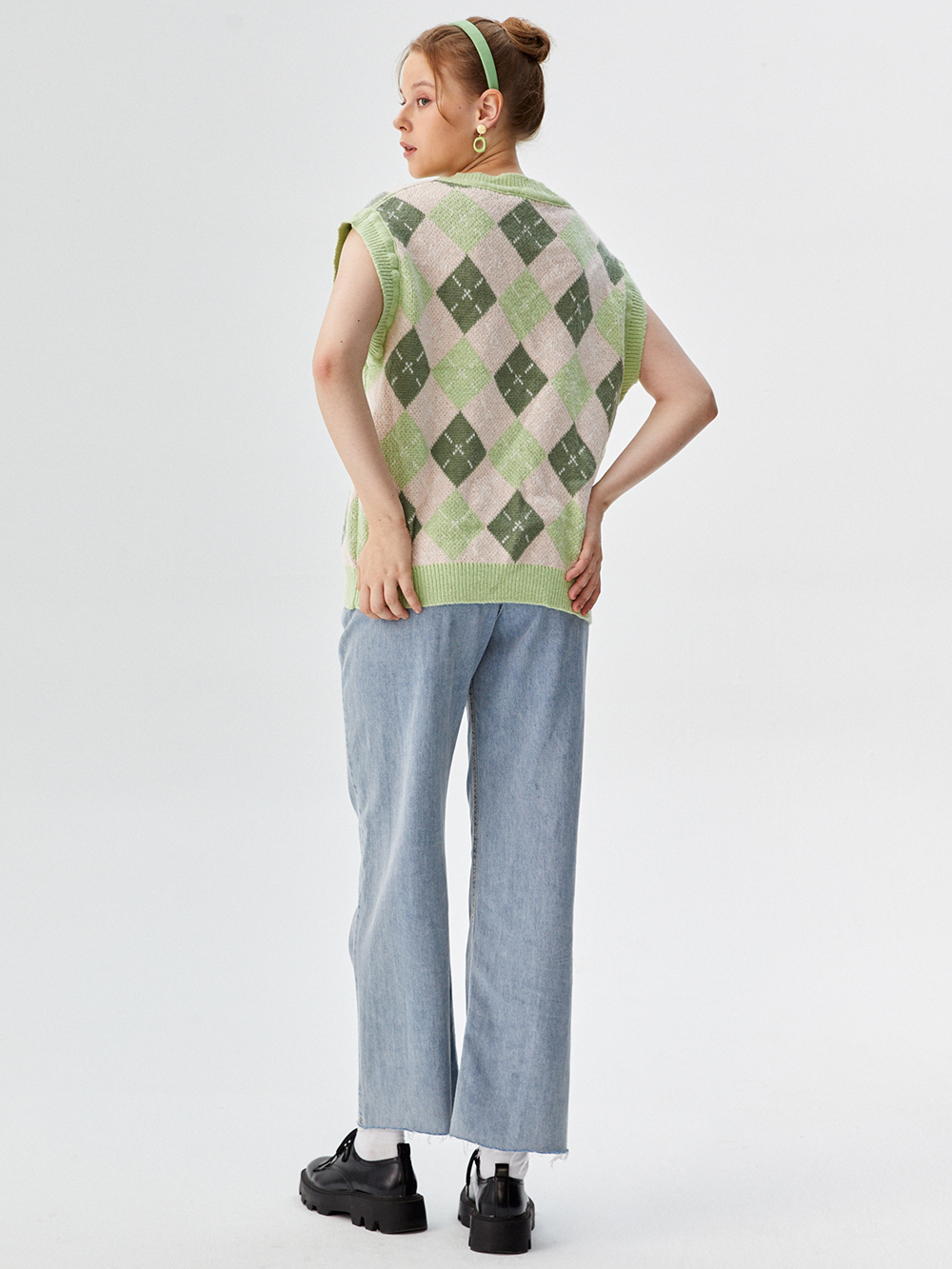 Professional AI Product Photography for Sweater Vests with Studio Model featuring Studio Model wearing Sweater Vests in Minimalist White Studio, Professional style.