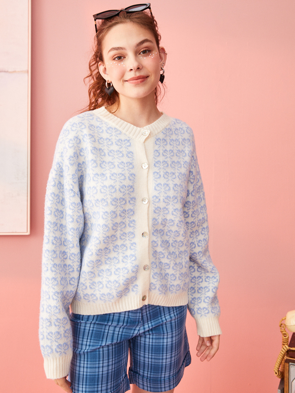 Professional Ghost Mannequin to Model for Apparel with Studio Model featuring Studio Model wearing Cardigan in Minimalist Solid Color Background, Trustworthy style.