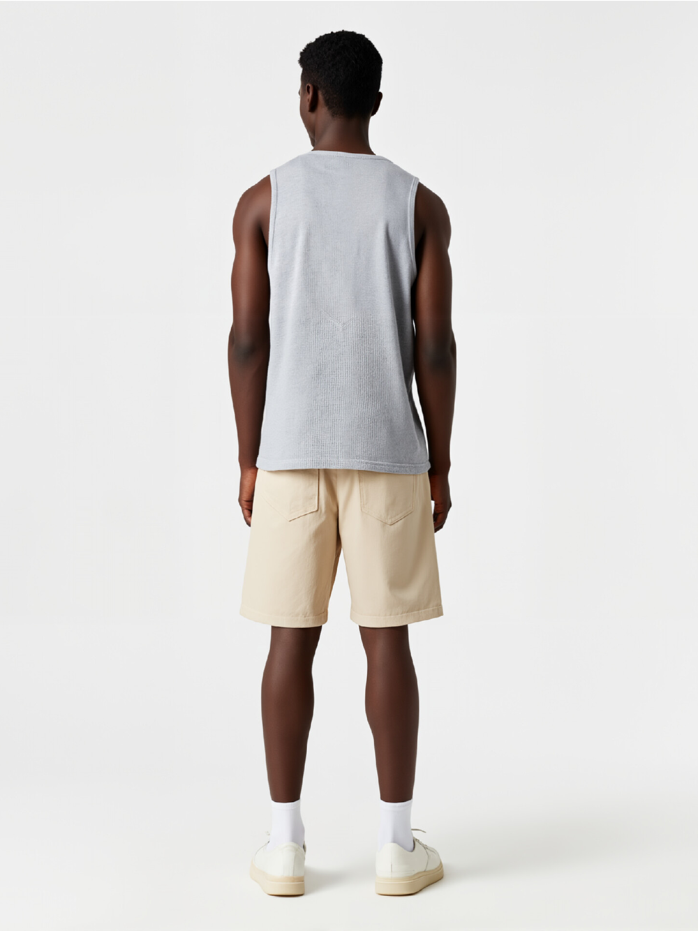 Professional AI Product Photography featuring Black Model wearing Sleeveless T-Shirts in Minimalist White Studio, Professional style.